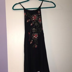 Black halter tank top with an embroidered design!